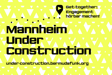 Vergrößerte Ansicht von Auf gelbem Hintergrund geschrieben: &quot;Mannheim Under Construction&quot;